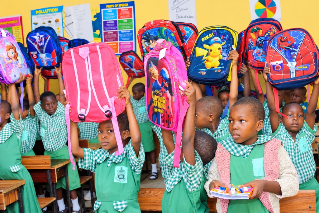 Children Receiving School Bags